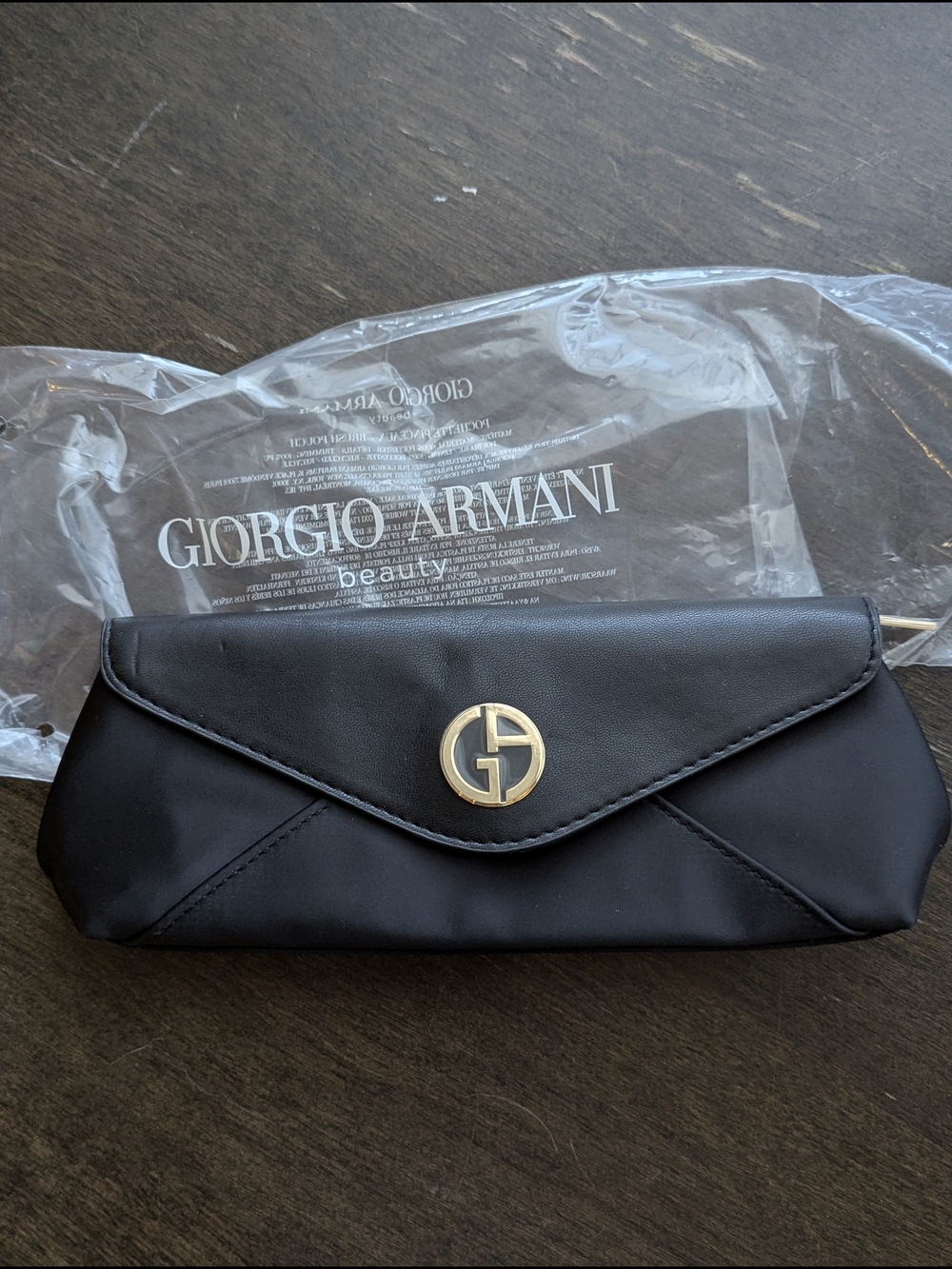 Giorgio Armani black clutch with gold logo medallion/ Small Beauty Bag